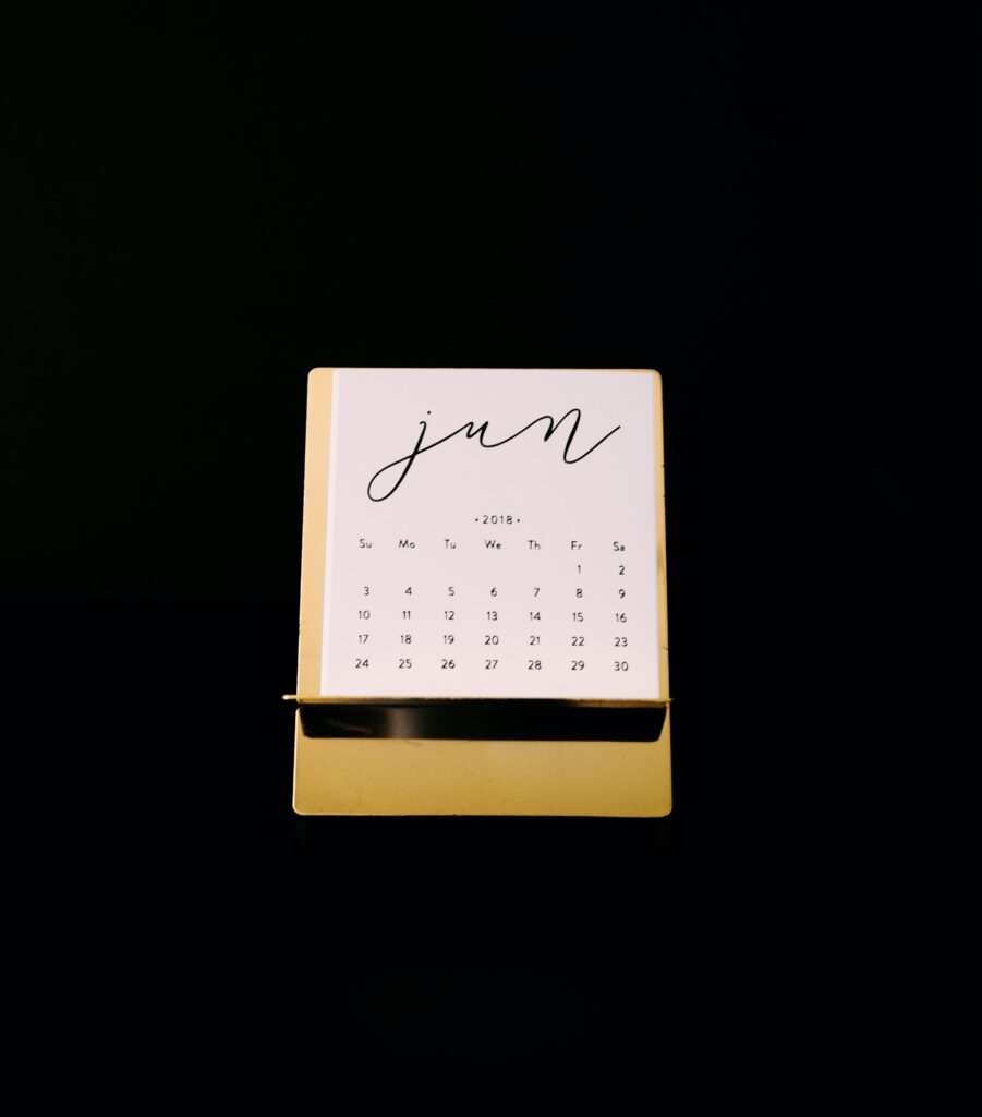 yellow desk calendar with the month of June showing