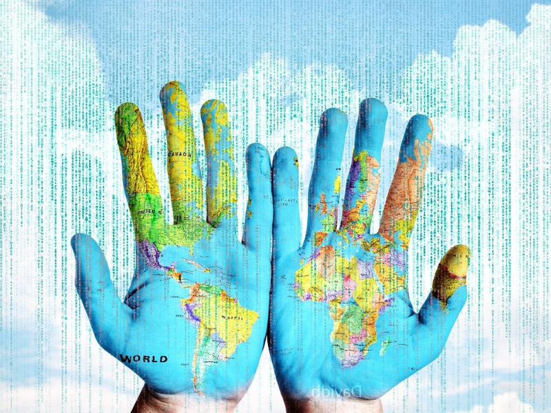 Time mapping puts the power to change how you use time into your hands, like these hands with a colorful map of the world painted on them agsinst an abstract background of white clouds and blue sky.