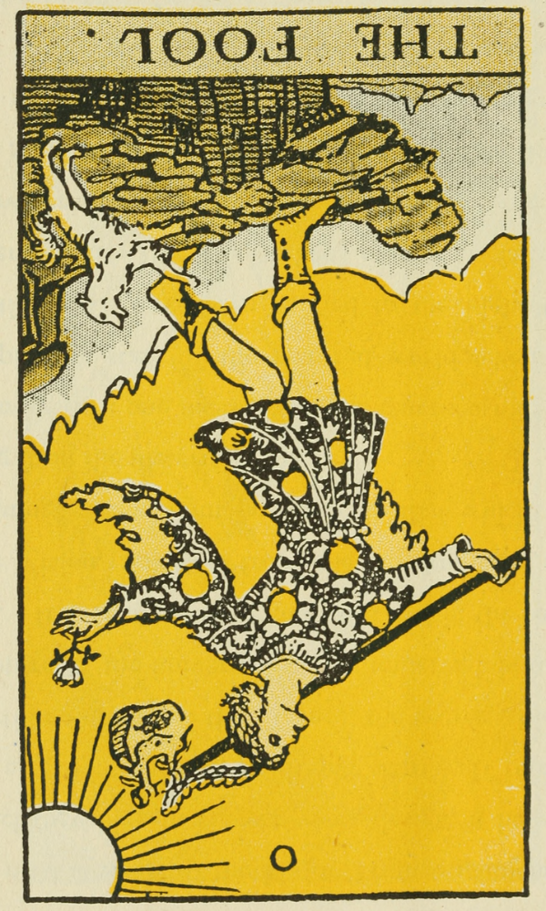 The Fool card, upside-down. This card is found in the book The Illustrated Guide to the Tarot and is copyright-free. (I turned it upside-down; the reversal is mine.) The Fool is an androgynous person in a short jerkin ending just about the knees. The color tone in the image is golden yellow. The Fool's boots are yellow, the jerkin is black and white what might be flowers or also stars with golden suns amid the pattern. The Fool is carrying a white might be rose in their left hand and a staff holding a knapsack at the top which has the shape of a purse, or even a lock. There's a feather coming out of the top of the Fool's head that also looks like a chain holding the purse to the staff. A small white Shelty-looking dog barks at the Fool, raising up on its two hind feet, as the Fool is leaning back, quietly contemplating stepping off the edge of a cliff into an abyss. White, glacier-like, sharply peaked mountains are in the background. The Sun as a simple partial circle is seen in the righthand corner of the image in pale yellow with rays as simple lines streaming out from it and the number "0" in the center of the image at the top, the words "The Fool" on a pale yellow-gray bar at the bottom.